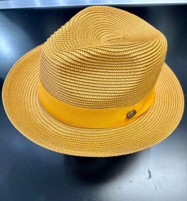 A yellow hat with a yellow band is sitting on a table