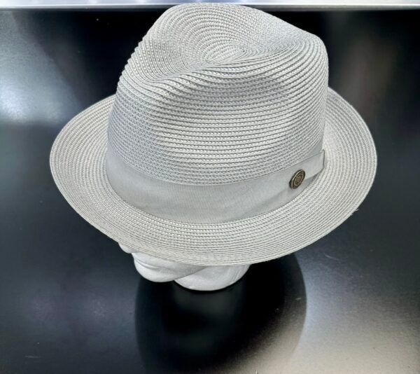 A white hat is sitting on a black surface