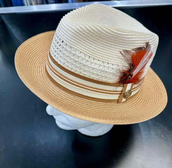 A hat with feathers on it is on a mannequin head