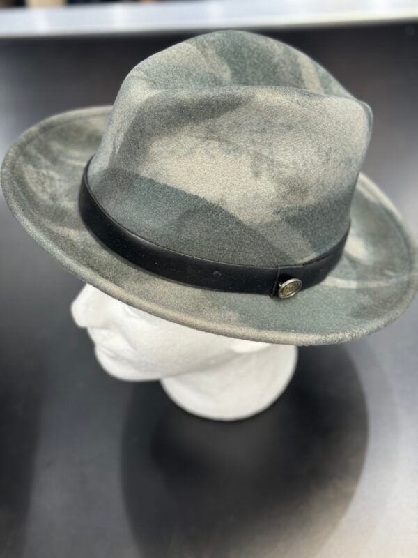 A hat with a black band is on a mannequin head.