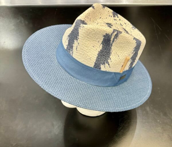 A hat with a blue band is on a mannequin head.