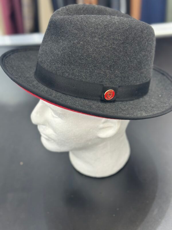 A black fedora hat is on a mannequin head.