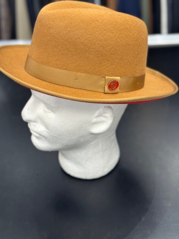 A brown fedora hat is on a mannequin head.