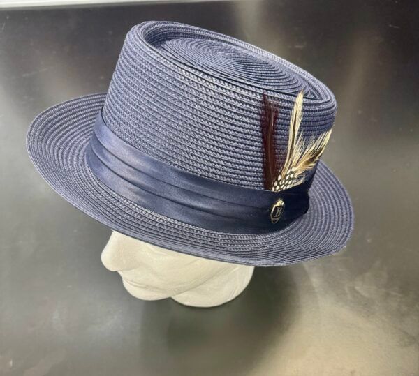 A blue hat with feathers is on a mannequin head