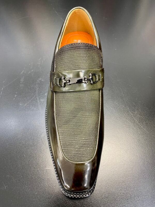 A close up of a pair of shoes on a table.