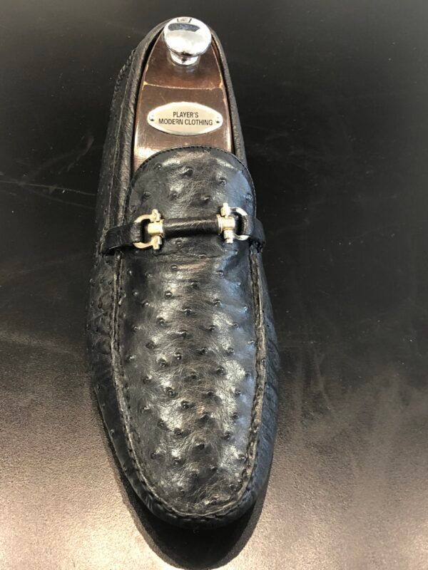 A pair of black loafers made of ostrich leather