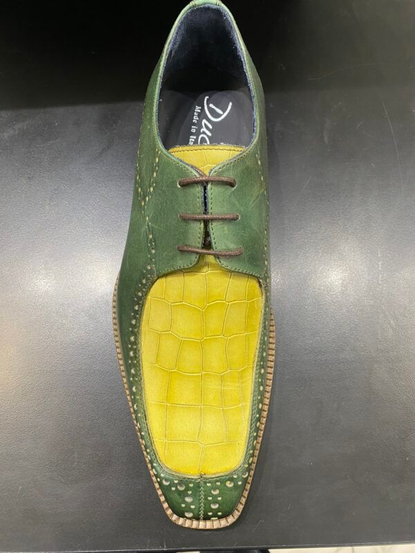 A pair of green and yellow shoes with laces