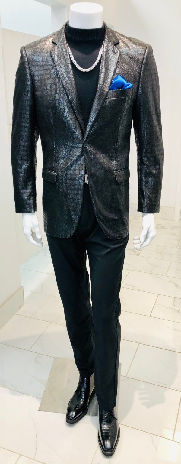 A man is wearing a black jacket and black pants on a mannequin.