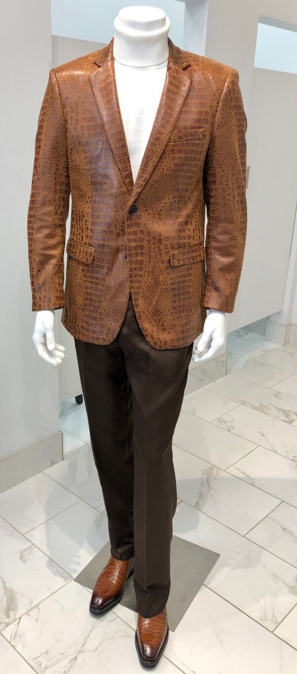 A mannequin is wearing a brown leather jacket and brown pants.