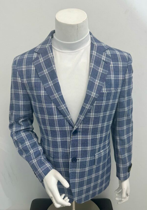A blue and white plaid jacket is on a mannequin