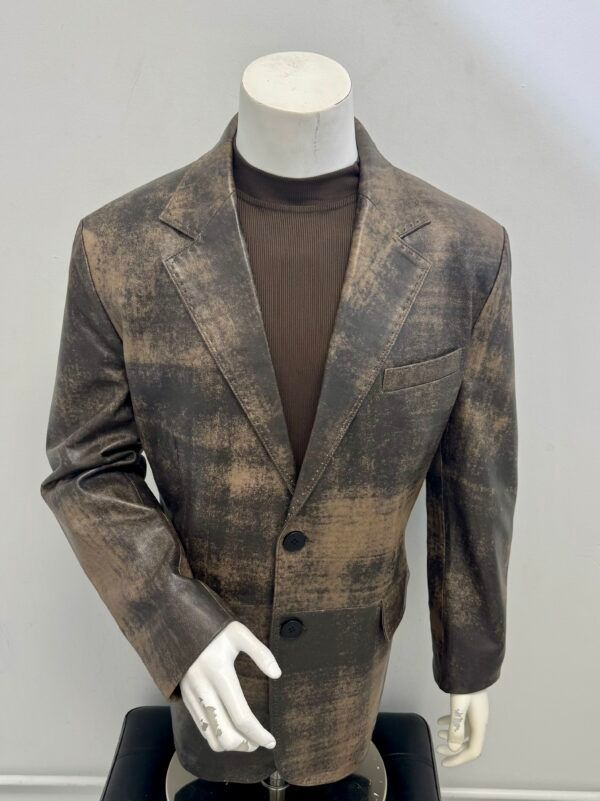 A mannequin is wearing a brown jacket and a brown shirt.