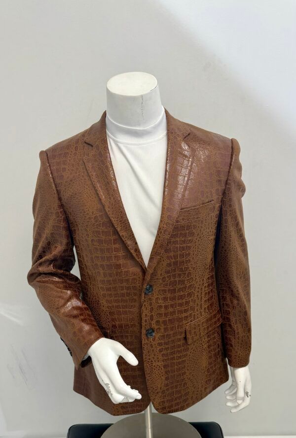 A mannequin wearing a brown jacket and a white turtleneck