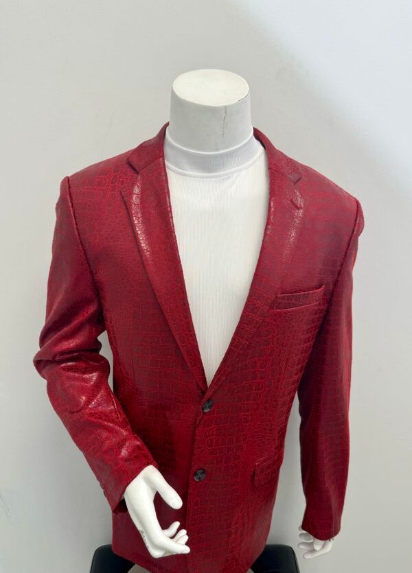 A mannequin is wearing a red jacket and a white turtleneck