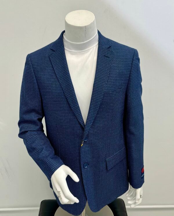 A mannequin wearing a blue jacket and white shirt