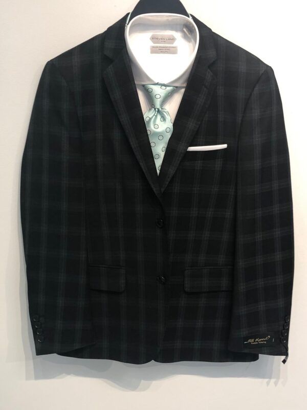 A black plaid suit jacket with a white shirt and tie