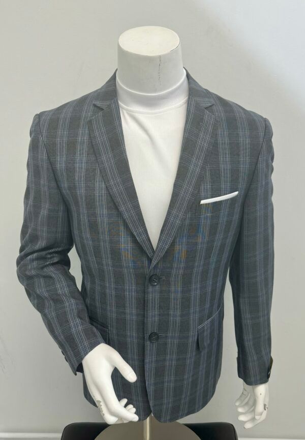 A mannequin wearing a grey plaid jacket and a white turtleneck