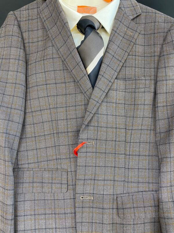 A close up of a suit jacket and tie