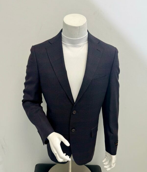 A mannequin wearing a suit jacket and white turtleneck