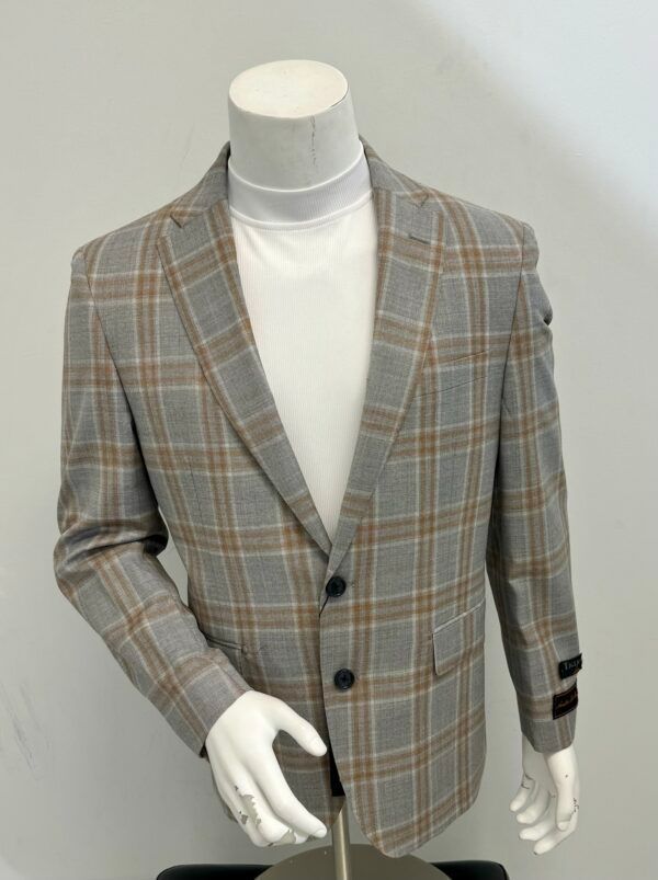 A mannequin is wearing a plaid jacket and a white turtleneck.