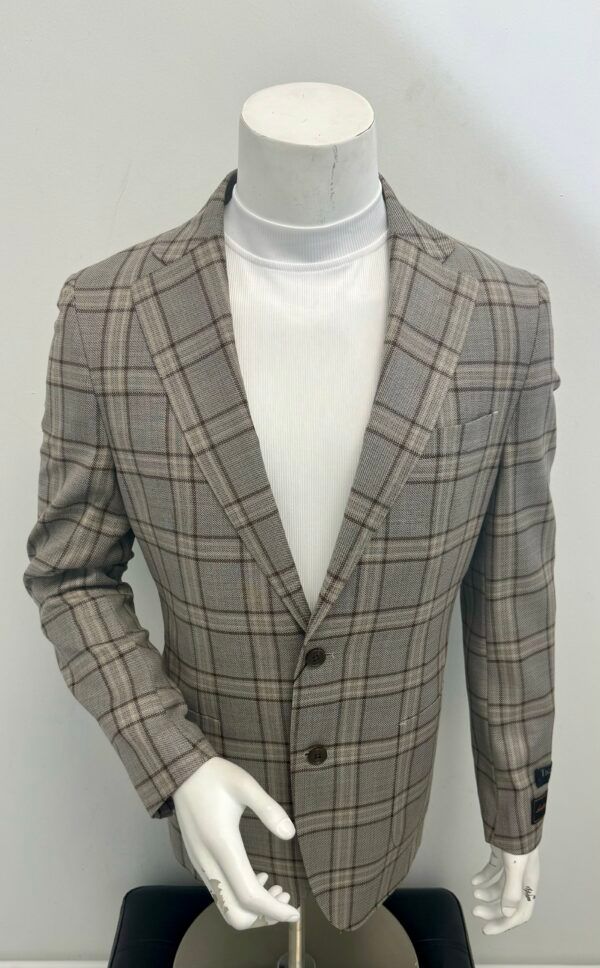 A mannequin is wearing a plaid jacket and a white turtleneck.
