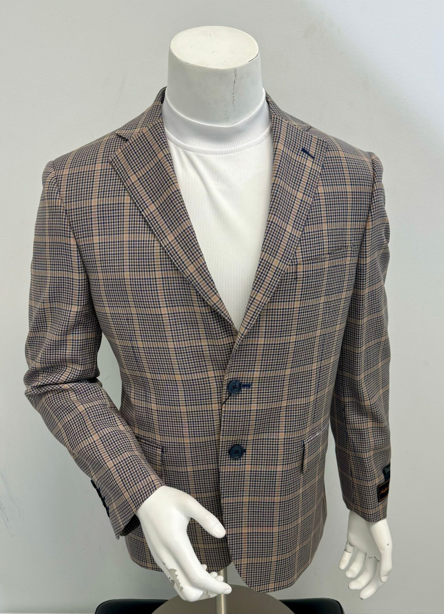 A mannequin wearing a jacket and a white shirt
