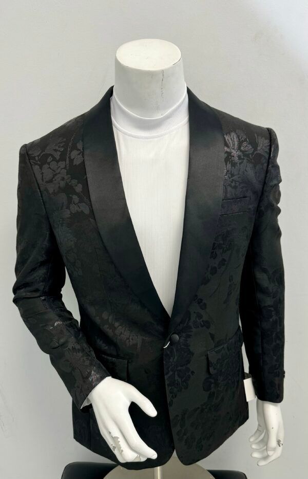 A black tuxedo jacket is on a mannequin
