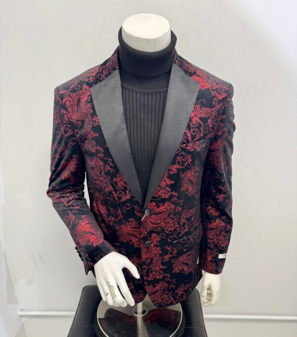 A mannequin is wearing a red and black tuxedo jacket.