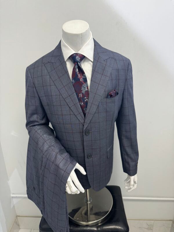 A mannequin is wearing a suit and tie