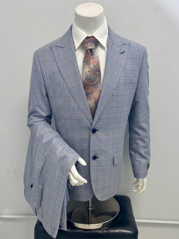 A mannequin is wearing a suit jacket and tie.
