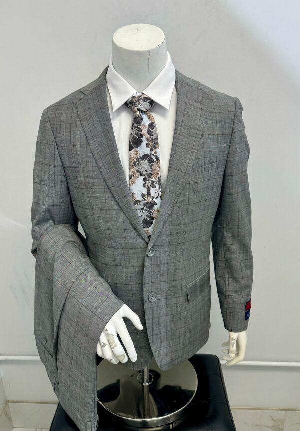 A man in a suit and tie is on a mannequin.