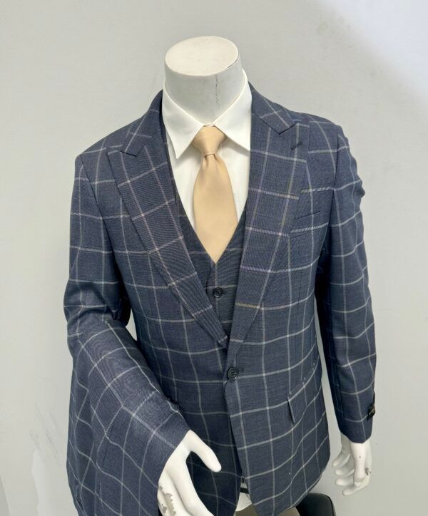 A mannequin is wearing a suit and tie