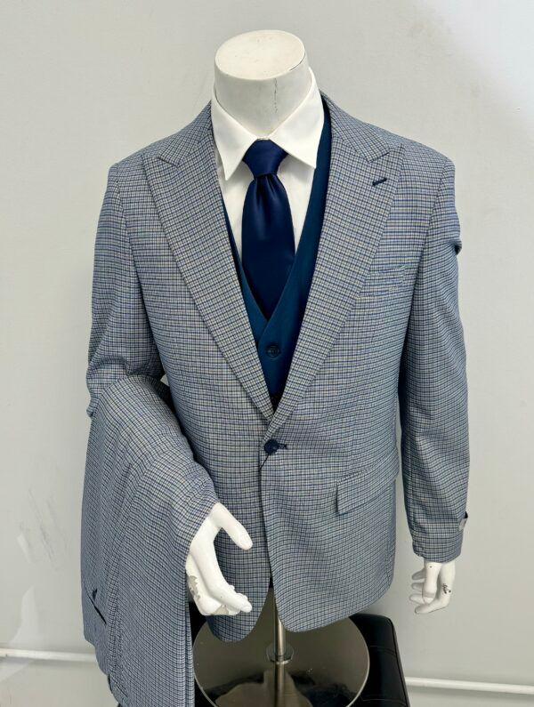 A mannequin is wearing a suit jacket and tie