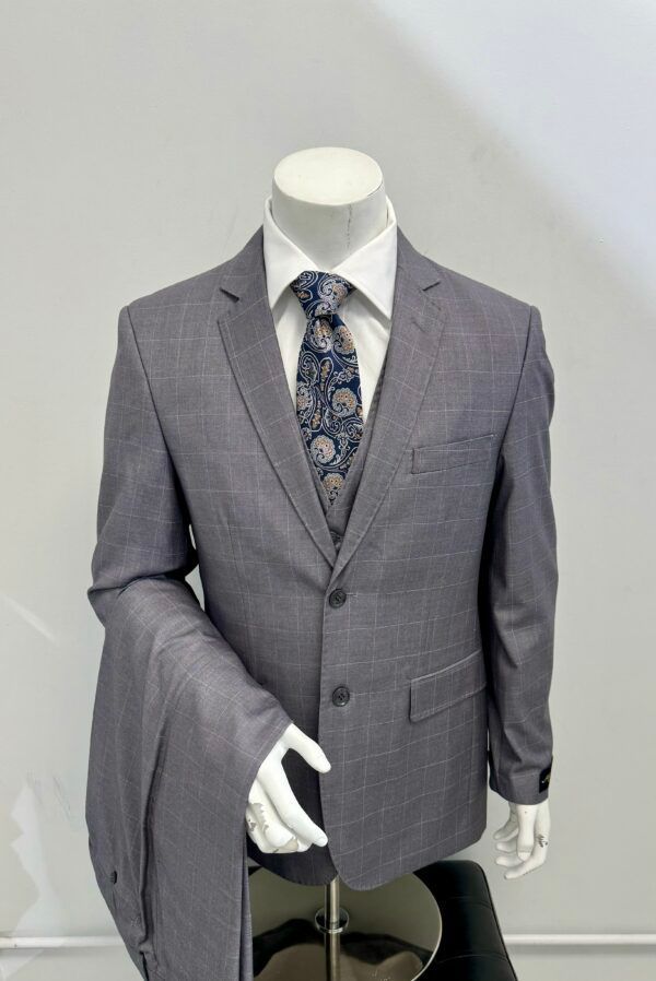 A man is wearing a suit and tie on a mannequin.