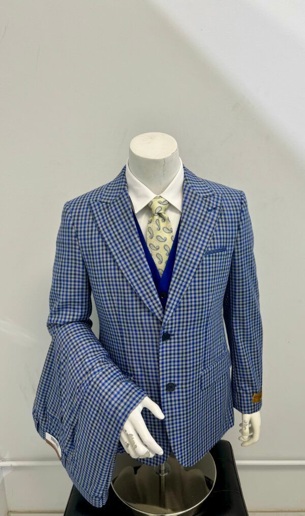 A mannequin is wearing a blue suit and tie.