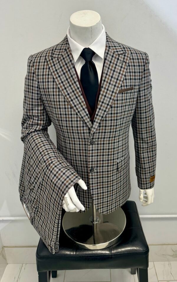 A mannequin is wearing a plaid suit and tie.