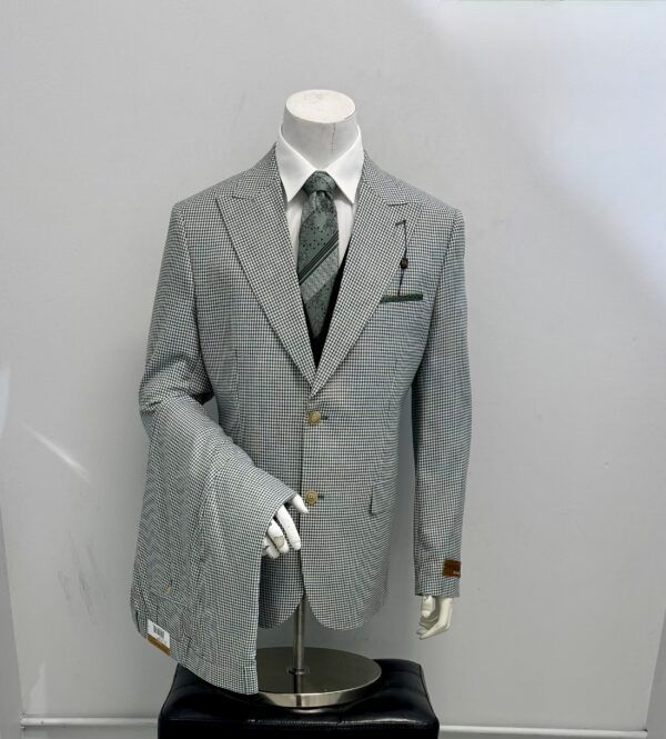 A mannequin is wearing a striped suit and tie