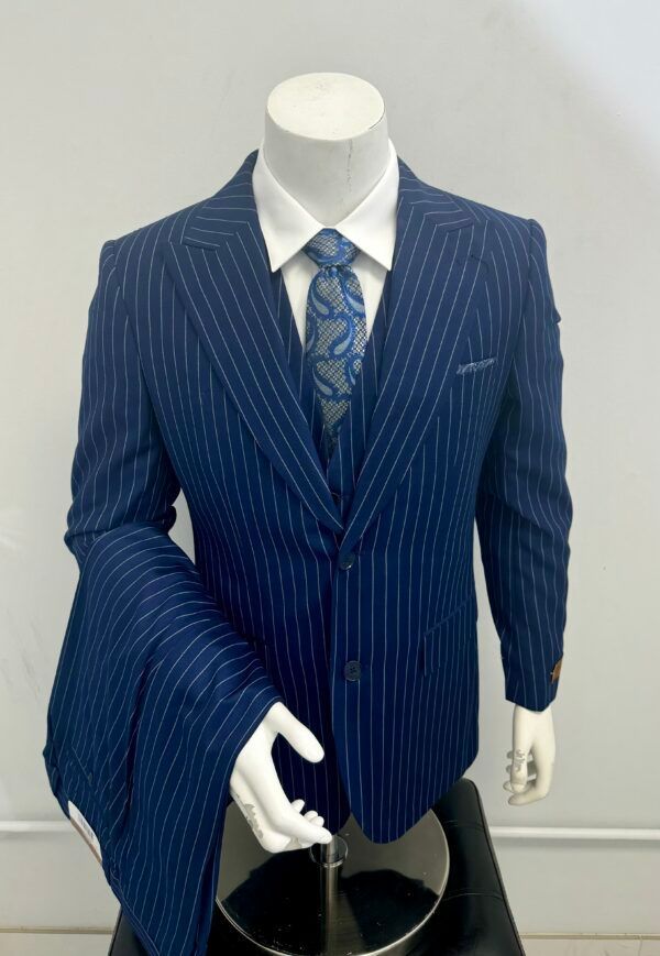 A mannequin is wearing a blue striped suit and tie.