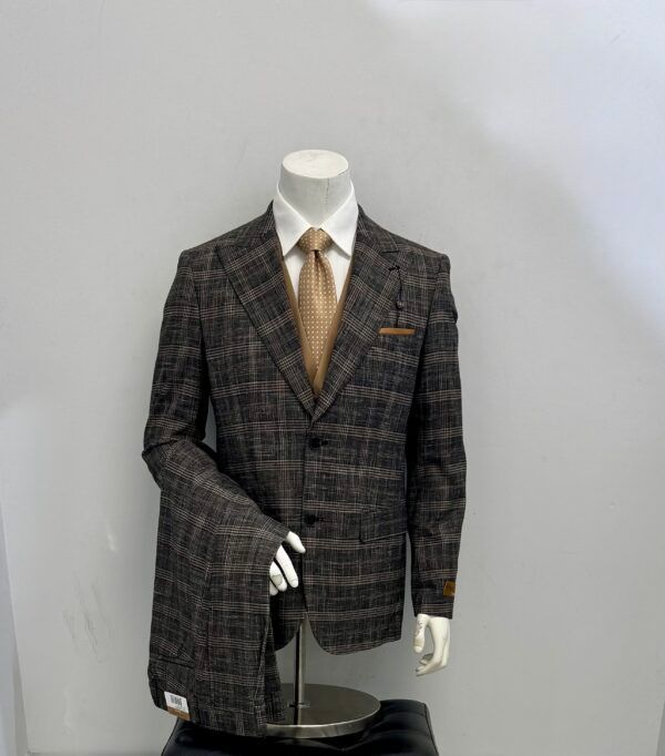 A mannequin is wearing a plaid suit and tie