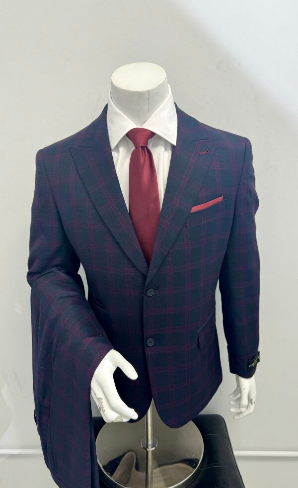 A mannequin is wearing a suit and tie.