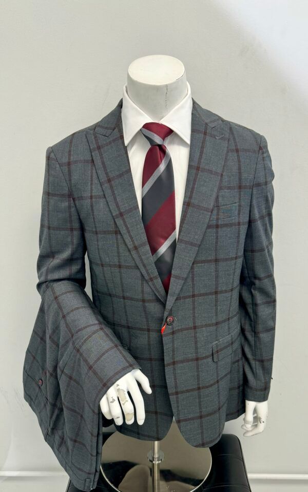 A man is wearing a suit and tie on a mannequin.