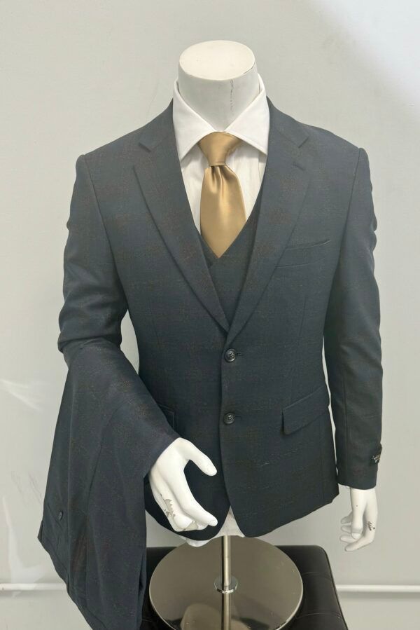A mannequin is wearing a suit and tie
