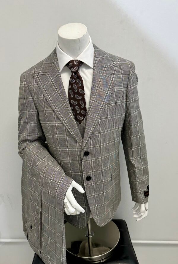 A man is wearing a suit and tie on a mannequin.