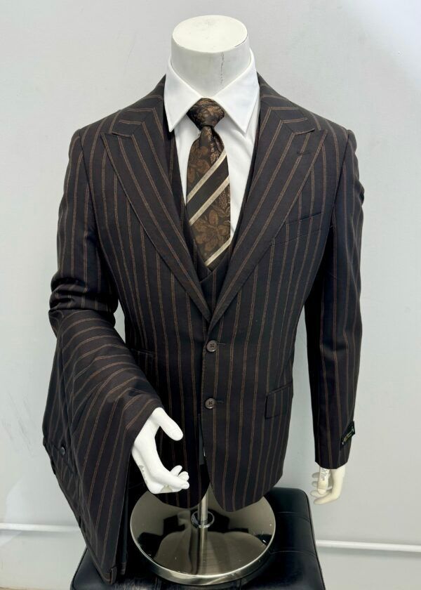 A mannequin wearing a brown striped suit and tie