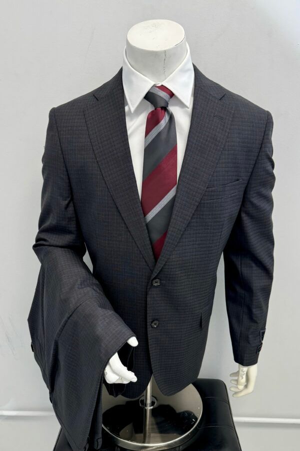 A man in a suit and tie is on a mannequin