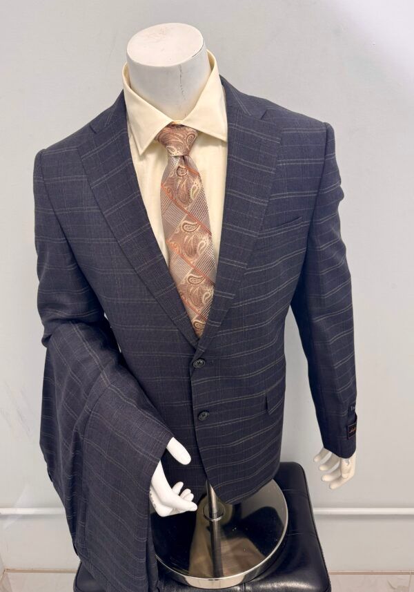 A mannequin is wearing a suit and tie