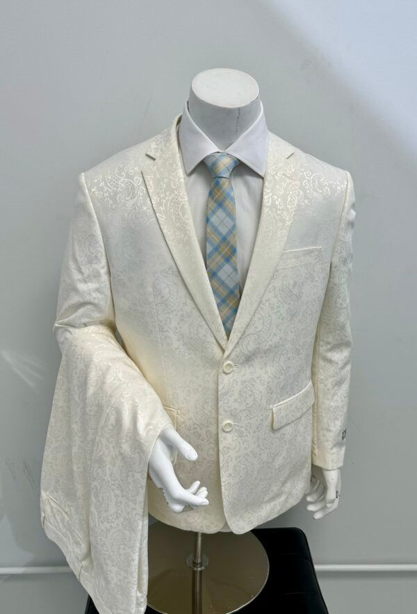 A mannequin is wearing a white suit and tie.