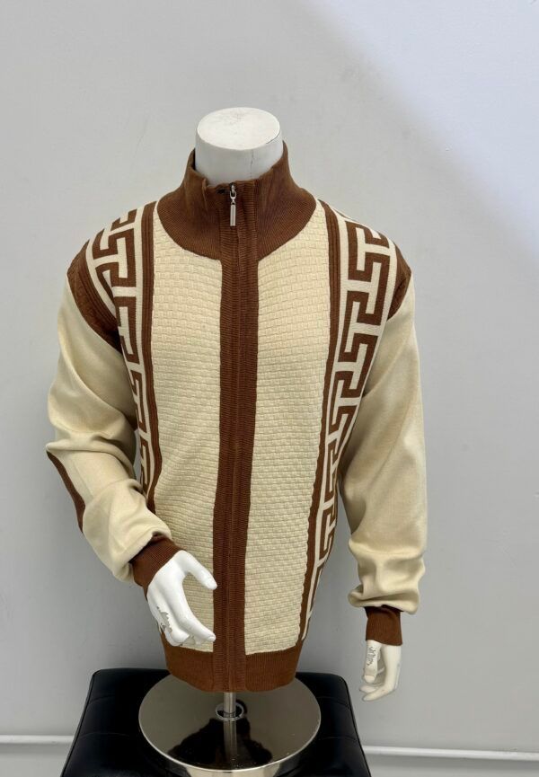 A mannequin is wearing a brown and white jacket with a greek key pattern.