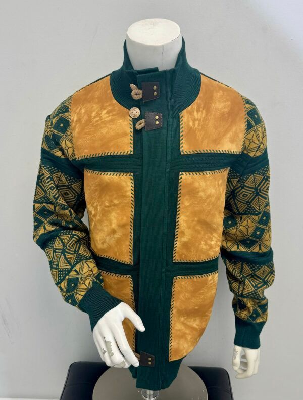 A mannequin is wearing a green and tan jacket