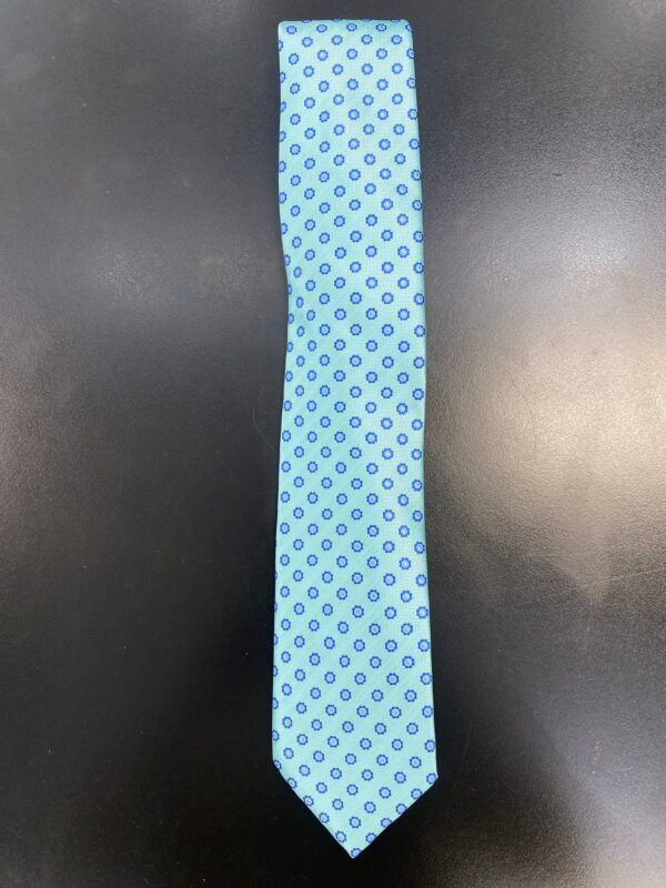 A light blue tie with blue circles on it