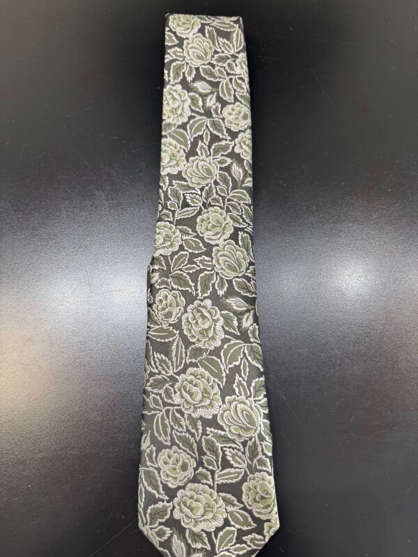 A black tie with white roses on it